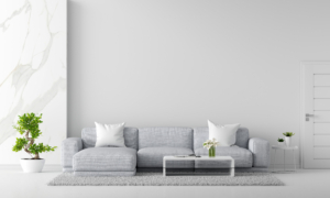 Gray sofa in white living room with copy space, 3D rendering